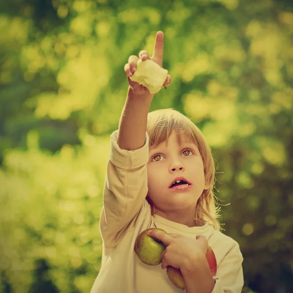 Boy with apples gesturing — Stock Photo, Image