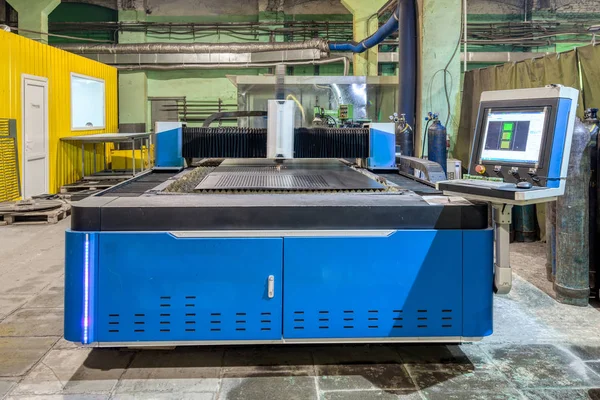 The machine for laser cutting of metal makes the cutting of a metal sheet.