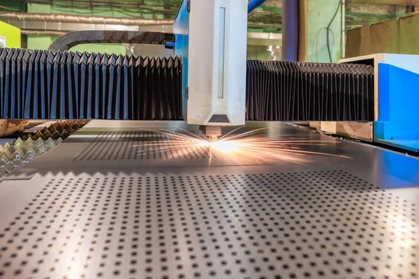 The machine for laser cutting of metal makes the cutting of a metal sheet.