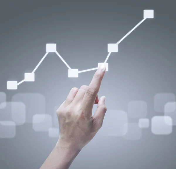 Hand touching graphs of financial indicator — Stock Photo, Image