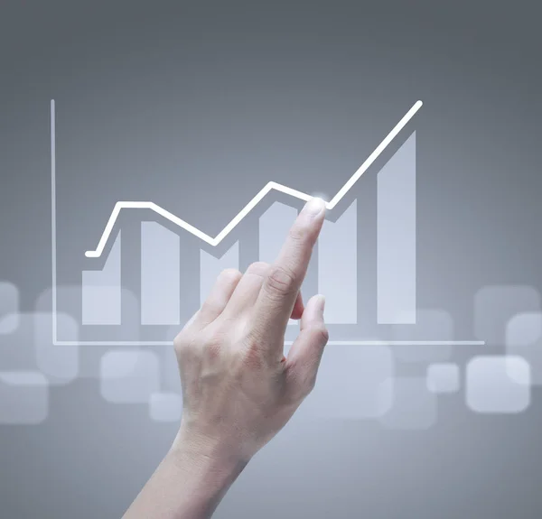 Hand touching graphs of financial indicator — Stock Photo, Image