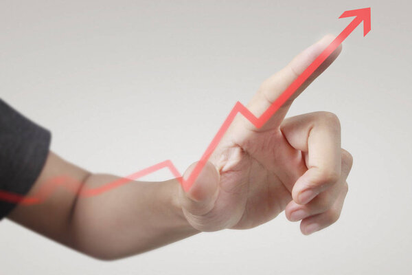Hand touching  graphs of financial indicator and accounting mark