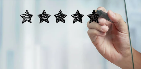 Hand draw a five star rating. evaluation and review concepts