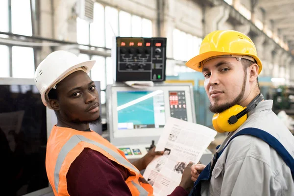 Serious Confident Handsome Multiethnic Factory Colleagues Hardhats Looking Camera While — Stock Photo, Image