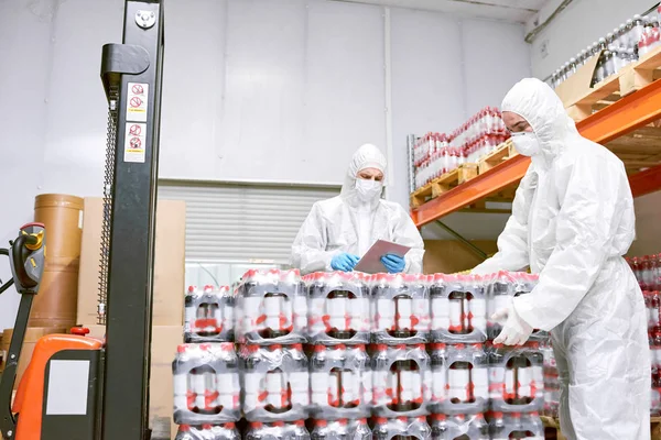 Sports Nutrition Production Workers Protective Clothing Unloading Packs Plastic Bottles — Stock Photo, Image