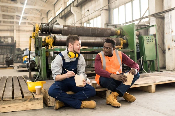 Multi Ethnic Team Technicians Wearing Overalls Sitting Spacious Production Department — Stock Photo, Image