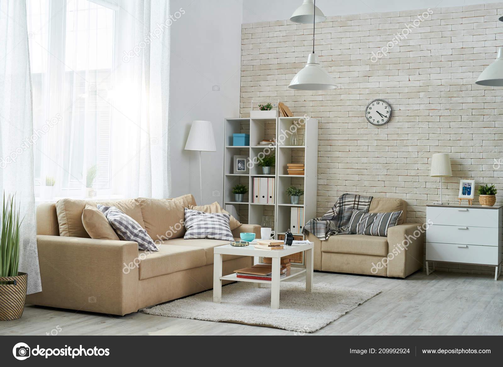 Cozy Living Room Brick Wall Light Furniture Dresser Bookshelf