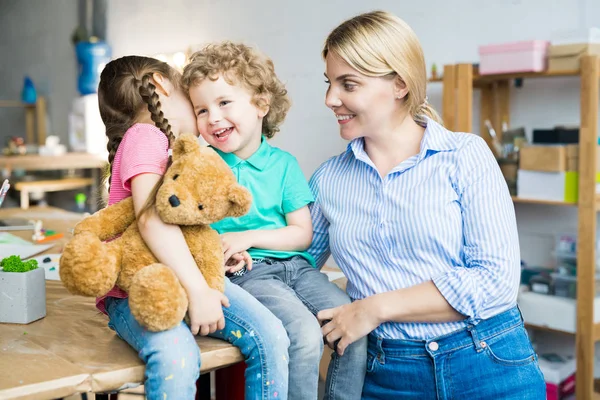 Warm Toned Portrait Young Mother Two Cute Little Kids Laughing — Stock Photo, Image