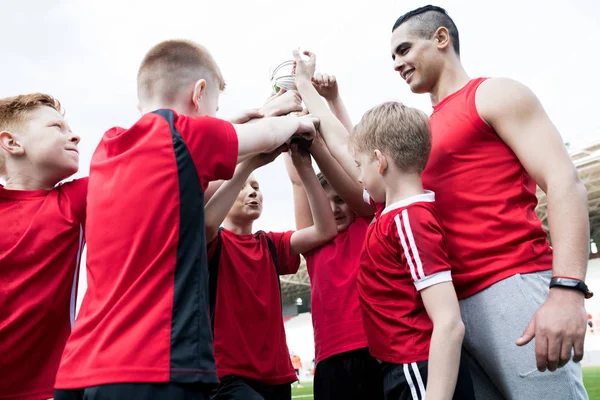 Portrait Happy Junior Football Team Holding Trophy Together Cheering Winning — Stock Photo, Image