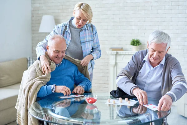 Woman Caring Elderly Patients Covering Man Plaid While Playing Lotto — Stock Photo, Image