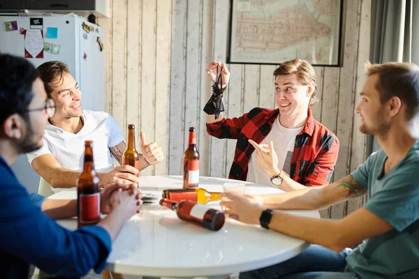 Young Man Boasting Female Underwear Showing His Friends While Drinking — Stock Photo, Image