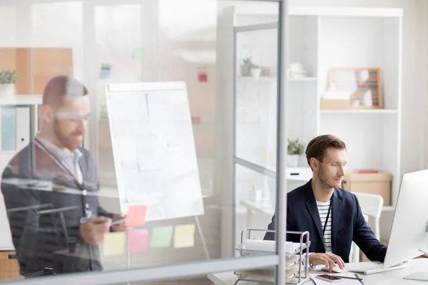 Portrait Two Modern People Working Office Cubicles Separated Glass Walls — Stock Photo, Image