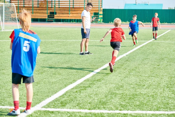 Full Length Portrait Boys Running Sprints Physical Education Lesson Football — Stock Photo, Image