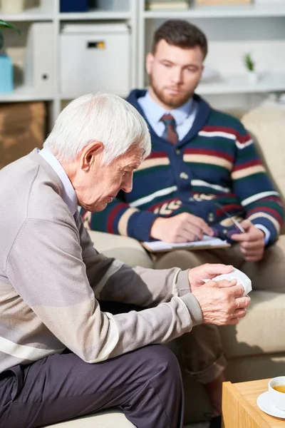 Serious Pensive Senior Man Sitting Sofa Looking While Telling His — Stock Photo, Image