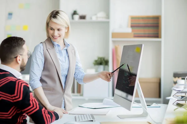 Cheerful Confident Pretty Web Designer Blond Hair Standing Table Pointing — Stock Photo, Image