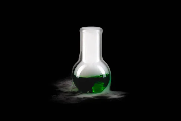 Close Glass Flask Green Steaming Liquid Black Background Copy Space — Stock Photo, Image