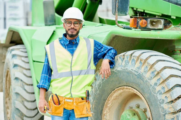 Handsome Man Hardhat Waistcoat Leaning Wheel Heavy Vehicle Looking Camera — Stock Photo, Image