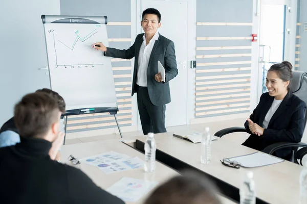 Young Smiling Businessman Drawing Financial Graphs Flip Chart Presenting His — Stock Photo, Image