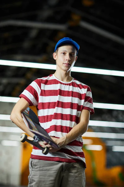 Youthful Guy Casualwear Holding Skateboard While Having Break Parkour Training — Stock Photo, Image