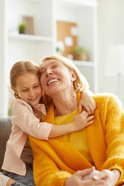 Portrait Cute Little Girl Embracing Mature Woman Laughing Playfully — Stock Photo, Image