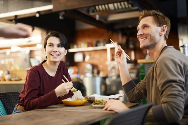 Portrait Cheerful Young Couple Enjoying Asian Food Restaurant Copy Space — Stock Photo, Image