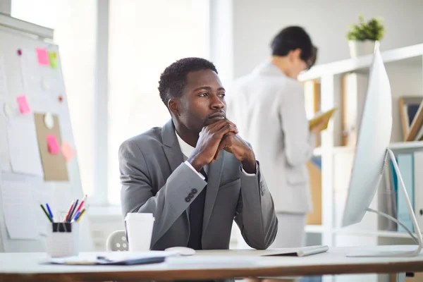 Young Pensive Tired Broker Looking Computer Screen While Analyzing Data — Stockfoto