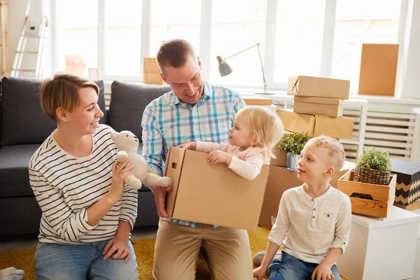 Cheerful Positive Young Parents Entertaining Younger Kid New Home Father — Stock Photo, Image