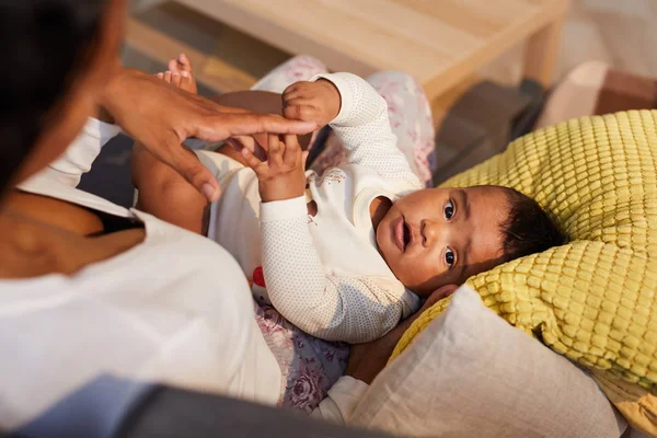 Close Emotional Black Baby Boy Milky Bodysuit Touching Mothers Fingers — ストック写真