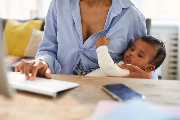 Close Concentrated African Baby Boy Keeping Mothers Shirt Looking Computer — ストック写真