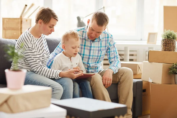 Content Curious Blond Haired Son Sitting Parents Sofa Living Room — Stock Photo, Image