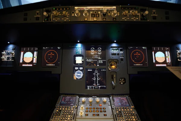 Modern interior of jet aircraft cockpit with small monitors for managing flight control system, copy space