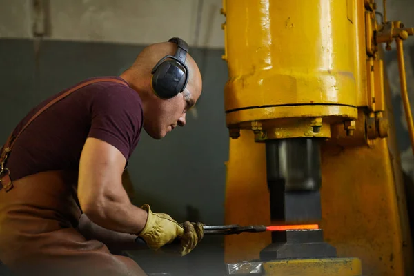 Concentrated Bald Workman Ear Protectors Applying Hydraulic Pressure Change Shape — Stock Photo, Image