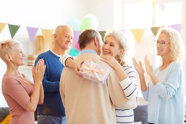 Happy Excited Mature Lady Gray Hair Holding Birthday Gift Hugging — стоковое фото