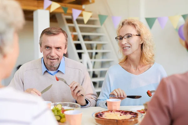 Positive Mature Friends Casual Sweaters Sitting Table Eating Food While — Stock Photo, Image