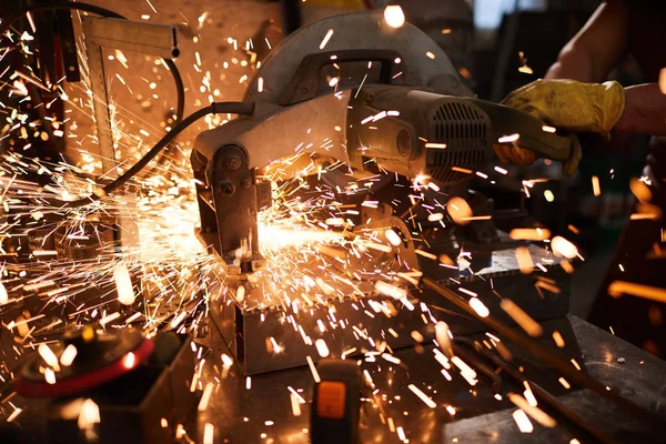 Close Metalworker Using Circular Saw While Cutting Metal Workshop Sparkles — Stock Photo, Image