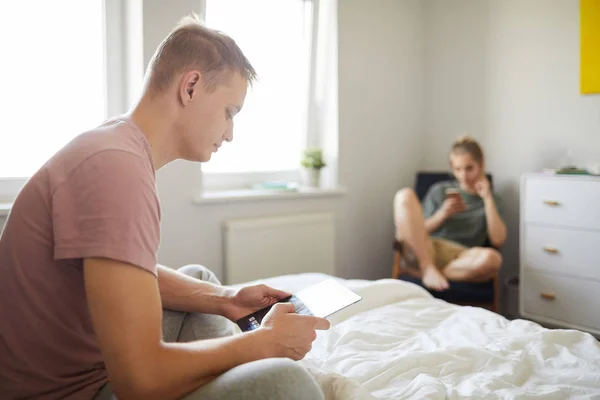 Contemporary Guy Mobile Gadget Sitting Bed While Scrolling Tablet His — Stock Photo, Image