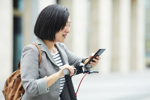 Waist Side View Modern Asian Woman Checking Smartphone While Riding — Stock Photo, Image