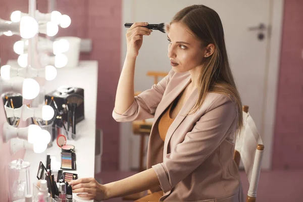 Side View Portrait Beautiful Young Woman Putting Makeup While Looking — Stock Photo, Image