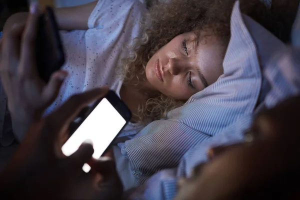 Portrait Curly Haired Young Woman Using Smartphone While Lying Boyfriend — Stock Photo, Image