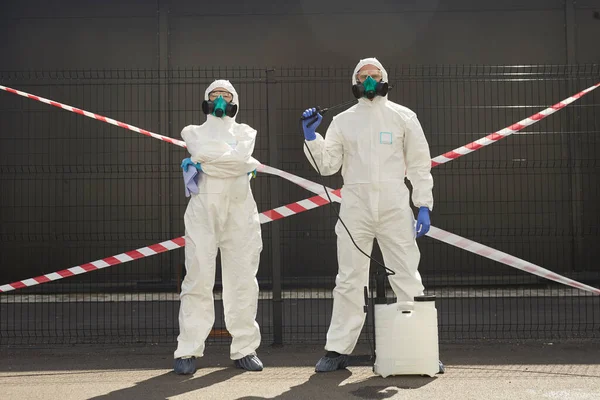 Full Length Portrait Two Workers Wearing Hazmat Suits Holding Disinfection — Stockfoto