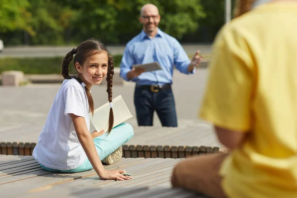 Portrait Smiling Teenage Girl Looking Classmate While Enjoying Outdoor Lesson — Stock Photo, Image
