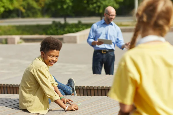 Portrait Smiling African American Boy Looking Classmate While Enjoying Outdoor — Stock Photo, Image