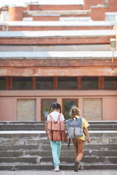 Vertical Back View Portrait Two Sisters Going School Backpacks While — Stock Photo, Image