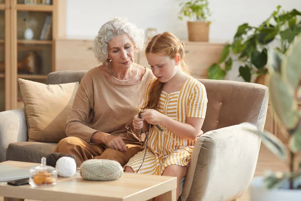 Warm Toned Portrait Elegant Senior Woman Teaching Granddaughter Knitting While — Stock Photo, Image