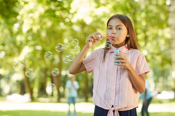 Waist Portrait Teenage Girl Blowing Bubbles Looking Camera While Standing — Stock Photo, Image