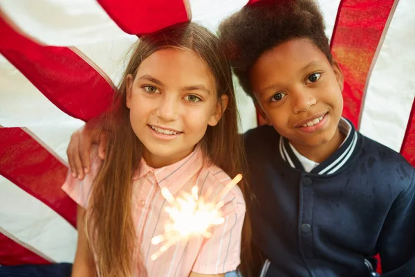 Portrait Two Cute Girls Holding Sparkling Lights Smiling Camera Usa — Stock Photo, Image