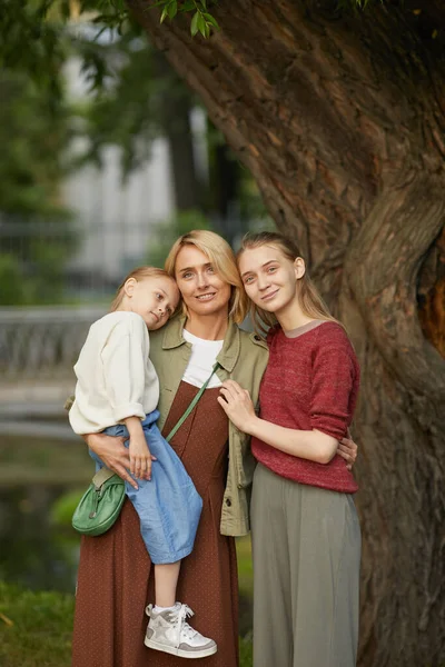 Vertical Portrait Modern Adult Mother Two Daughters Posing Together Smiling — Stock Photo, Image