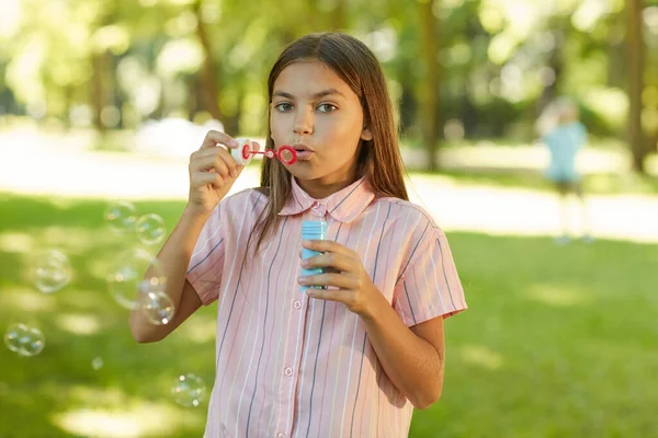Waist Portrait Teenage Girl Blowing Bubbles While Standing Green Park — Stock Photo, Image
