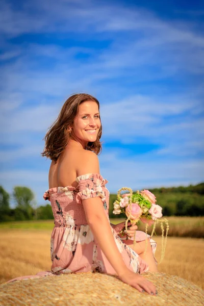 Young Woman Summer Dress Sitting Straw Bale Flowers Lets Wind — Stock Photo, Image