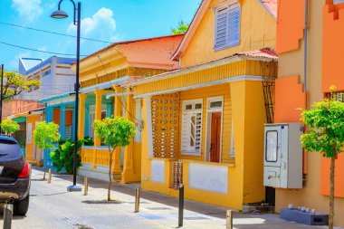 Typical yellow house in Puerto Plata, Dominican Republic. Beautiful and contemplative clipart